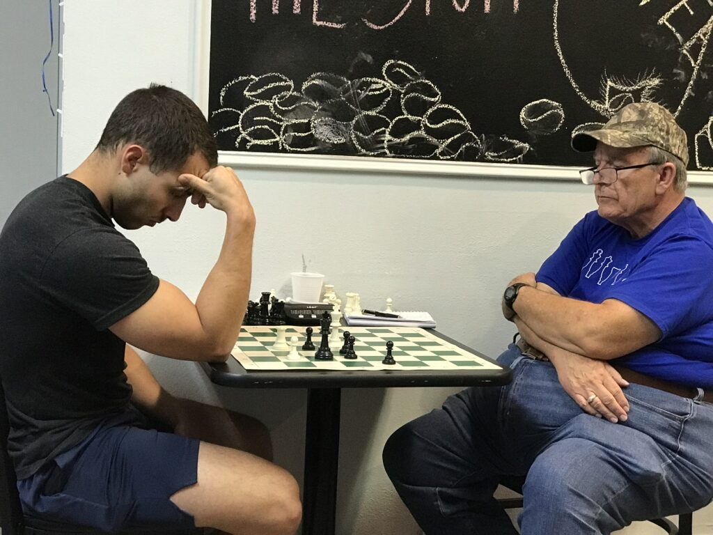 Endgame. Image of Noah Falkovich (L) and Danny Hardesty (R) playing chess. By Brenda Hardesty.