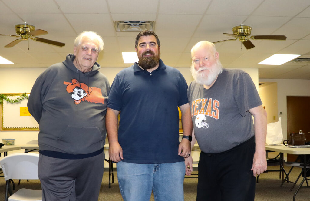 In this photo, from left to right, are veterans Troy Gillispie, Matt Wood, and Jim Hollingsworth. Mr. Gillispie is a veteran of the Vietnam War Era. He is also the Director of Outreach for TCA Affiliate Arlington Chess Club. Mr. Wood is a veteran of Operation Iraqi Freedom (OIF) and Operation Enduring Freedom (OEF). He is also the Pastor of Belmore Baptist Church, the tournament's host. Mr. Hollingsworth was reactivated from the Individual Ready Reserve (IRR) for the Global War on Terrorism (GWOT). He is a former TCA Vice President and is President of TCA Affiliate Texas Armed Forces Chess. Both Hollingsworth and Gillispie are Life Members of TCA and US Chess.